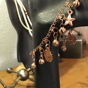 Copper charm bracelet suns clams moon star
